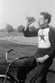 Young speedway cyclists racing their bikes at Wormwood Scrubs Image preview
