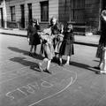 Children playing hopskotch in a street in Ladbroke Grove Image preview