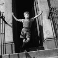 Boy standing on the steps of a house in Ladbroke Grove Image preview