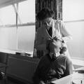 A nurse examines a girl's eye in the Minor Ailments Room at Kidbrooke School Image preview