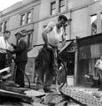 A road repairer operates a pneumatic drill on Portobello Road Image preview