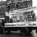 A float carrying demonstrators with plaquards supporting the Clerical and Administrative Workers' Union passes by on May Day Image preview