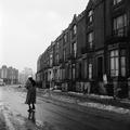 A woman photographed walking in the icy road on Bourne Terrace, Westminster Image preview