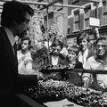 A salesmen displaying watches at Petticoat Lane market Image preview