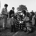 A group of children and adults around a dalek Image preview