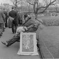 Man sleeping on a bench at the open air art exhibition, Embankment Image preview
