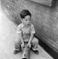 Boy playing with toy train Image preview