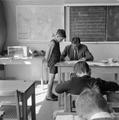 Teacher checking a pupils work at the Courtlands Primary School, Mill Hill Image preview