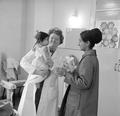 Doctor examining a baby at Neasden Clinic Image preview