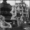 Selling newspapers from the steps of Eros, Piccadilly Circus Image preview
