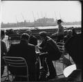 Dockers at lunchbreak by the lower pool of London Image preview