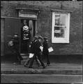 Schoolboys outisde the Harrow School Book Shop Image preview