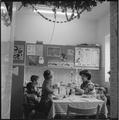 A Jewish family sit down to a meal during 'Sukkot' Image preview