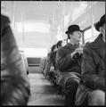 City gent on the top deck of a London bus Image preview
