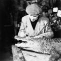 An employee of Edward Gerrard & Son's taxidermy firm works on a crocodile Image preview