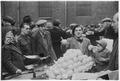 A trader sells fruit at Petticoat Lane street market Image preview